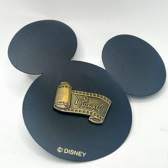 Walt Disney Signature Scroll Movie Film Strip Bronze Mini Pin on card EUC - Picture 1 of 3